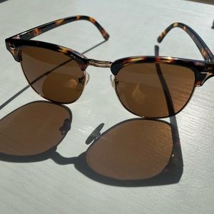 Tortoiseshell frame sunglasses with brown lenses.